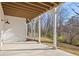 Covered patio with white support columns overlooking the well-manicured backyard at 2849 Parkridge Ne Dr, Brookhaven, GA 30319