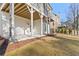 View of the covered patio area and large backyard with room to relax and play at 2849 Parkridge Ne Dr, Brookhaven, GA 30319