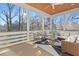 The screened porch features wood ceiling, white furniture, and a view of the backyard at 2849 Parkridge Ne Dr, Brookhaven, GA 30319