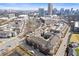 Gorgeous aerial view of a luxury apartment complex, complete with a serene pond and surrounded by green spaces, city skyline backdrop at 400 17Th Nw St # 2025, Atlanta, GA 30363
