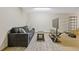 Spacious finished basement area complete with comfortable sofa, area rug, TV, and shelves at 400 17Th Nw St # 2025, Atlanta, GA 30363