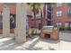 Outdoor courtyard with stone pillars, built in grill, seating and dining area at 400 17Th Nw St # 2025, Atlanta, GA 30363