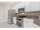 Well-lit kitchen featuring stainless steel appliances and white cabinets at 400 17Th Nw St # 2025, Atlanta, GA 30363