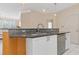 Open-concept kitchen with granite countertops and stainless steel appliances at 400 17Th Nw St # 2025, Atlanta, GA 30363