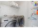 Efficient laundry room featuring modern Samsung washer and dryer, plus ample shelving for storage at 400 17Th Nw St # 2025, Atlanta, GA 30363