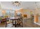 Open-concept living area combines comfort and style, featuring wood floors, a dining table and natural light at 400 17Th Nw St # 2025, Atlanta, GA 30363