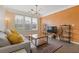 Bright living room featuring a comfy couch with accent pillows and a decorative rug on hardwood floors at 400 17Th Nw St # 2025, Atlanta, GA 30363