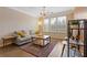Cozy living room with a plush couch, stylish shelves and a large window for plenty of natural light at 400 17Th Nw St # 2025, Atlanta, GA 30363