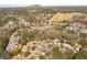 Aerial view of property showing surrounding neighborhood, pond, and Mountain in the distance at 6675 Princeton Park Ct, Lithonia, GA 30058