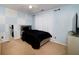 Bedroom featuring a dark comforter, light walls, and a mounted television at 6675 Princeton Park Ct, Lithonia, GA 30058
