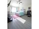 Spacious bedroom featuring vaulted ceiling, light grey flooring, and a large window with bright light at 9348 Lantana Trl, Jonesboro, GA 30238