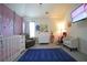 Spacious Bedroom features neutral paint, gray flooring, baby furniture, and a wall-mounted television at 9348 Lantana Trl, Jonesboro, GA 30238