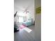 Bright bedroom with vaulted ceilings, modern decor, and a ceiling fan for year-round comfort at 9348 Lantana Trl, Jonesboro, GA 30238