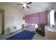 Charming Bedroom with a pink accent wall, butterfly decor, and a comfortable space at 9348 Lantana Trl, Jonesboro, GA 30238