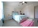 Bright bedroom with vaulted ceilings, modern decor, and a ceiling fan for year-round comfort at 9348 Lantana Trl, Jonesboro, GA 30238
