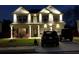 Stunning two-story home with brick facade, well-lit windows, and a spacious driveway for multiple vehicles at 9348 Lantana Trl, Jonesboro, GA 30238