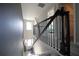 Bright foyer featuring gray walls, iron railing and staircase, and gray floors at 9348 Lantana Trl, Jonesboro, GA 30238