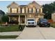 Beautiful two-story brick home featuring manicured lawn, and a spacious driveway for multiple vehicles at 9348 Lantana Trl, Jonesboro, GA 30238
