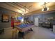 Finished garage with pool table, TV, unique decor, and a stylish epoxy floor at 9348 Lantana Trl, Jonesboro, GA 30238