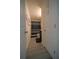 Hallway bathroom features neutral walls, gray floors, and modern shower curtain at 9348 Lantana Trl, Jonesboro, GA 30238