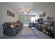 Stylish living room featuring modern furniture, a ceiling fan, and plenty of space for relaxation and entertainment at 9348 Lantana Trl, Jonesboro, GA 30238