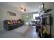 Inviting living room with ample seating, gray floors, and modern decorations at 9348 Lantana Trl, Jonesboro, GA 30238