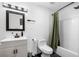 Modern bathroom featuring a shower-tub combo, vanity with sink, and white subway tile at 1377 Marston St, Smyrna, GA 30080