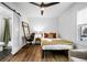 Bedroom with desk and ensuite bathroom with a sliding barn door entrance at 1377 Marston St, Smyrna, GA 30080