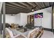 Covered outdoor patio with TV and seating area perfect for relaxing, dining and entertainment at 1377 Marston St, Smyrna, GA 30080