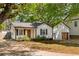 Charming home with a welcoming front porch and well-maintained landscaping at 1377 Marston St, Smyrna, GA 30080