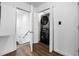Efficient laundry room with stacked washer and dryer, adjacent to storage at 1377 Marston St, Smyrna, GA 30080