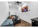 Bright living room with wood floors, a desk, TV, sectional couch and foosball table for recreation at 1377 Marston St, Smyrna, GA 30080