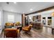 Open living room flows to a modern kitchen with wooden beams and stainless steel appliances at 1377 Marston St, Smyrna, GA 30080