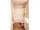 Bathroom featuring tub/shower combo and modern vinyl flooring at 2302 Waldrop Pl, Decatur, GA 30034