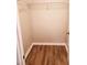 View of a tidy closet with a hanging rack and modern flooring at 2302 Waldrop Pl, Decatur, GA 30034