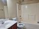 Well-lit bathroom featuring a tub/shower combo with neutral color palette at 2478 Brynfield Cv, Suwanee, GA 30024