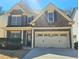 Attractive brick facade with a two-car garage and inviting entrance at 2478 Brynfield Cv, Suwanee, GA 30024