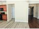 Open kitchen area with modern appliances and seamless flooring transitions at 2478 Brynfield Cv, Suwanee, GA 30024