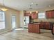 Spacious kitchen features stainless steel appliances, wood cabinets, and an island at 2478 Brynfield Cv, Suwanee, GA 30024