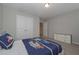 This cozy bedroom includes a double-door closet, carpeted floor, and natural light creating an inviting space at 2871 Fareed, Douglasville, GA 30135