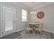 Cozy dining area features a round table with seating for four and a modern light fixture at 2871 Fareed, Douglasville, GA 30135