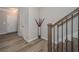 Hallway featuring wood-look floors, white trim, leading to a front door and a second story at 2871 Fareed, Douglasville, GA 30135