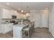 Bright kitchen with white cabinets, granite countertops, stainless steel appliances, and a center island at 2871 Fareed, Douglasville, GA 30135