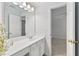 Bright bathroom features a white vanity with a sink and a view into the next room at 3311 Fieldwood Se Dr, Smyrna, GA 30080