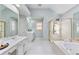 Bathroom features a separate shower and tub with an extended vanity with dual sinks at 3311 Fieldwood Se Dr, Smyrna, GA 30080