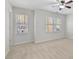 Bedroom with neutral carpet features two windows that provide natural light at 3311 Fieldwood Se Dr, Smyrna, GA 30080