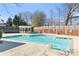 Community pool area showcasing the pool, a covered seating area, and surrounding fence at 3311 Fieldwood Se Dr, Smyrna, GA 30080