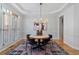 Bright dining room with modern chandelier, wood floors and stylish decor at 3311 Fieldwood Se Dr, Smyrna, GA 30080