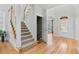 Inviting entryway with hardwood floors, staircase, and plenty of natural light at 3311 Fieldwood Se Dr, Smyrna, GA 30080