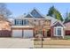 Attractive brick home with a manicured lawn, lovely landscaping and an attached garage at 3311 Fieldwood Se Dr, Smyrna, GA 30080
